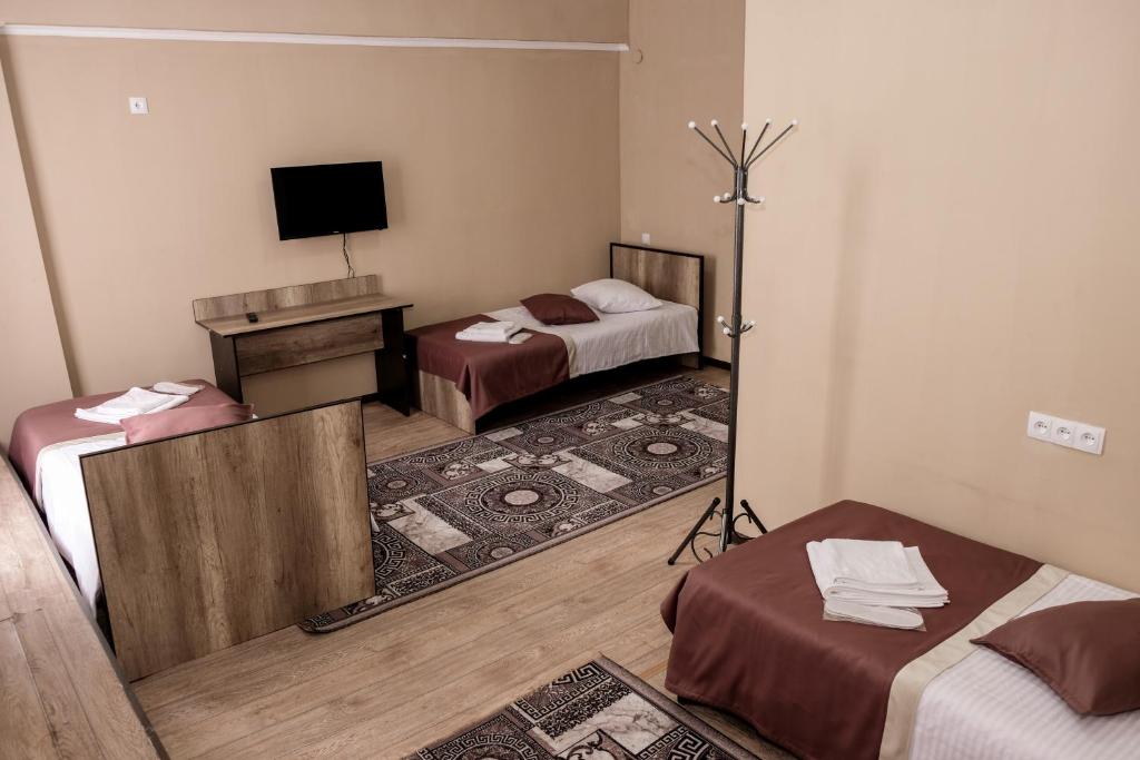 Postel nebo postele na pokoji v ubytování ORIENT