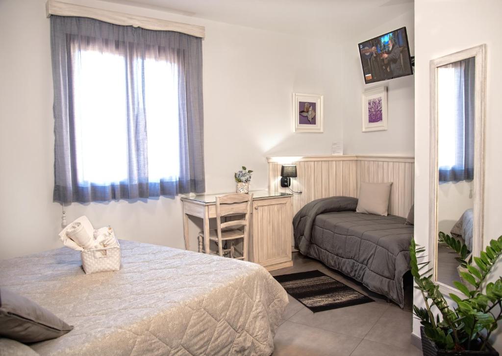 Postel nebo postele na pokoji v ubytování Bed and Breakfast Conte Luna