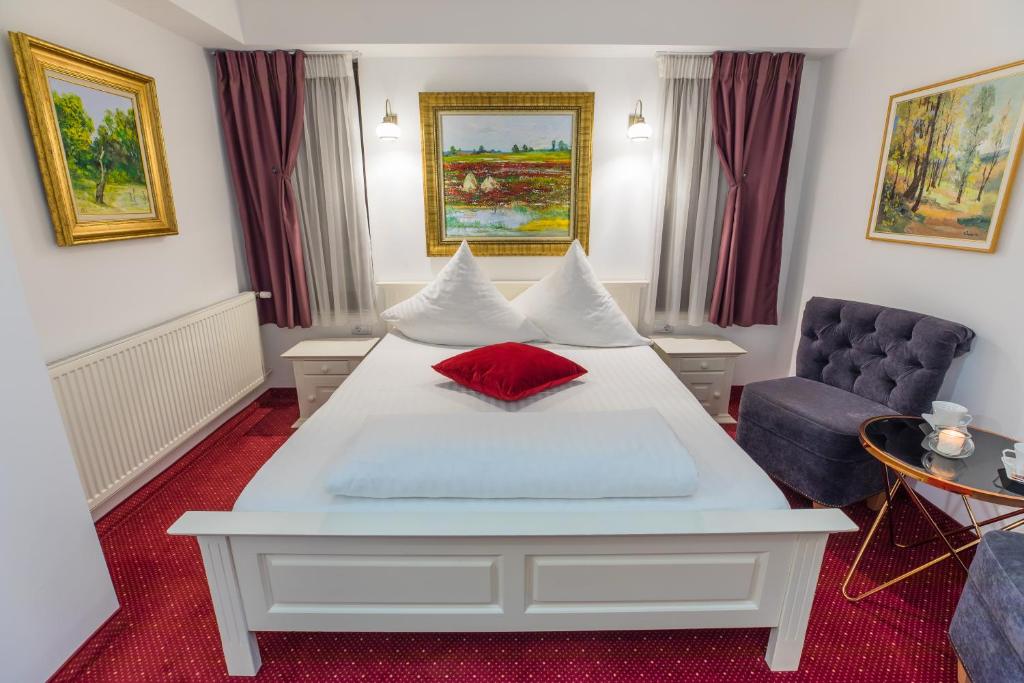 Un pat sau paturi într-o cameră la Hotel Casa David