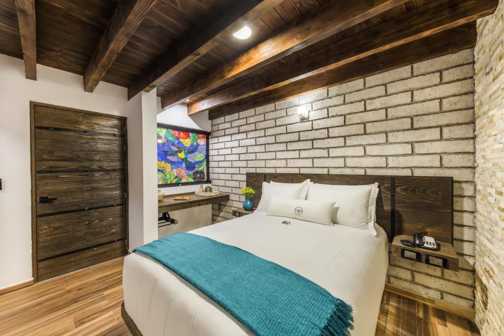 Postel nebo postele na pokoji v ubytování Matian Hotel Boutique