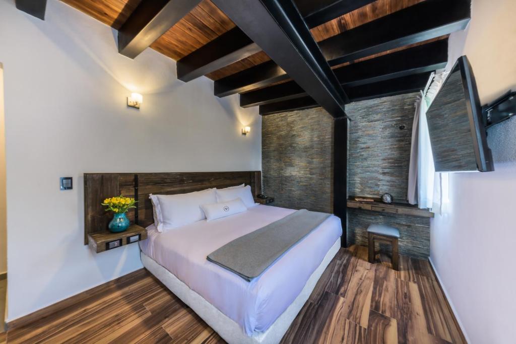 Postel nebo postele na pokoji v ubytování Matian Hotel Boutique