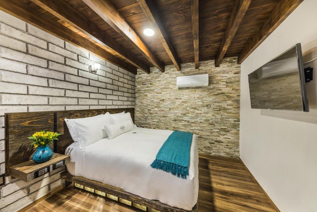 Postel nebo postele na pokoji v ubytování Matian Hotel Boutique