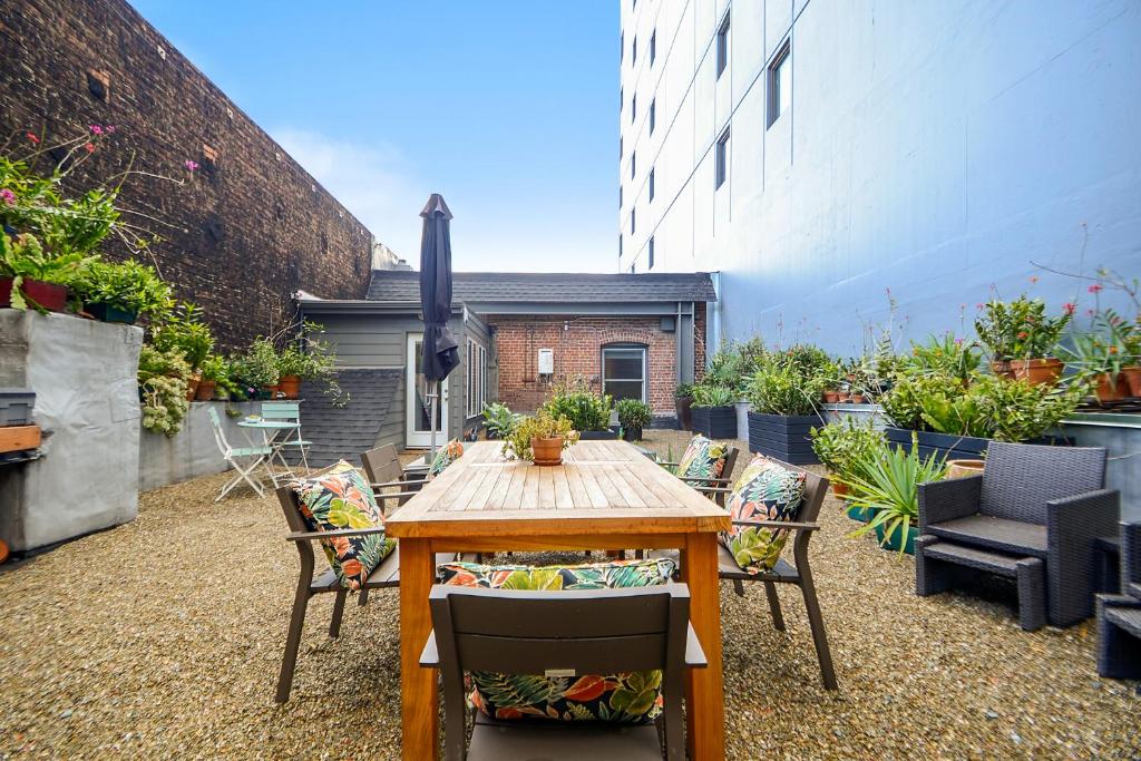 a patio with a wooden table and chairs at Loft in Lower Nob Hill in San Francisco