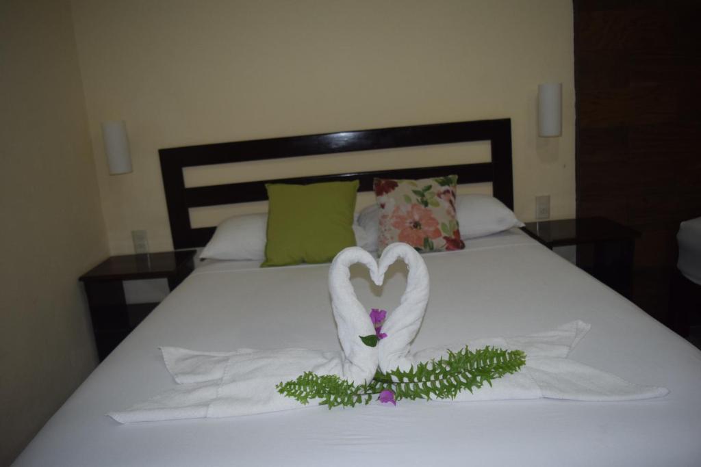 Postel nebo postele na pokoji v ubytování Hotel Tuparenda