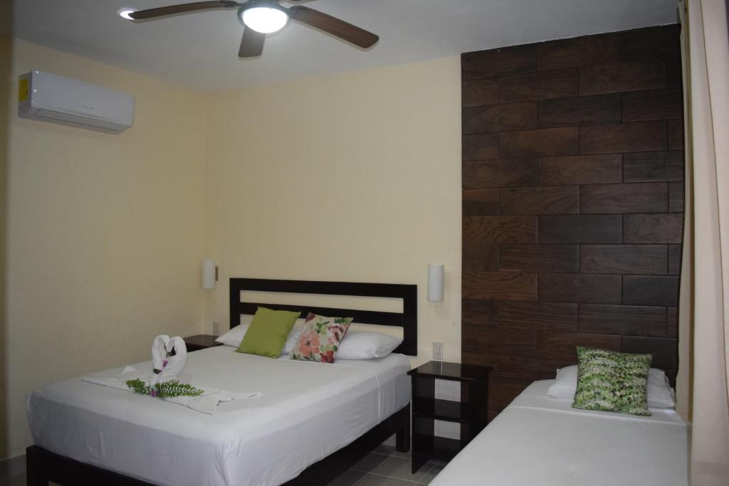 Postel nebo postele na pokoji v ubytování Hotel Tuparenda