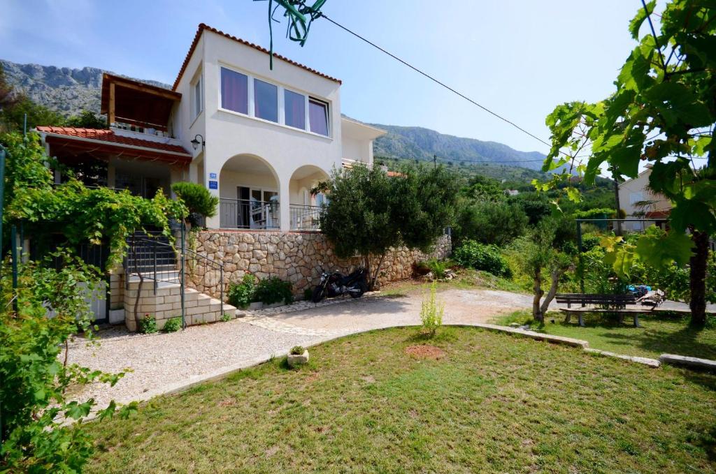 a villa with a view of the house at Apartments Bluesun in Omiš