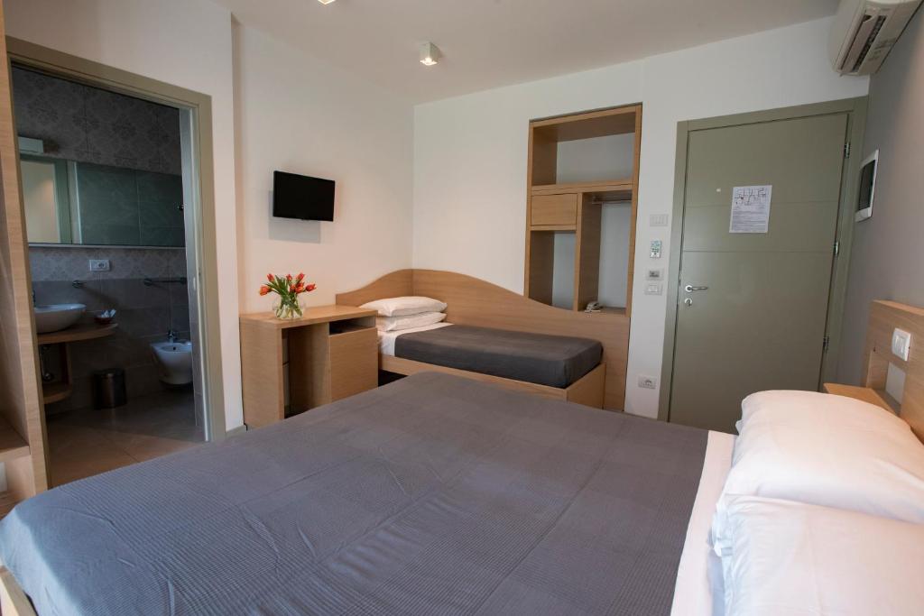 Postel nebo postele na pokoji v ubytování Hotel Liane Riccione
