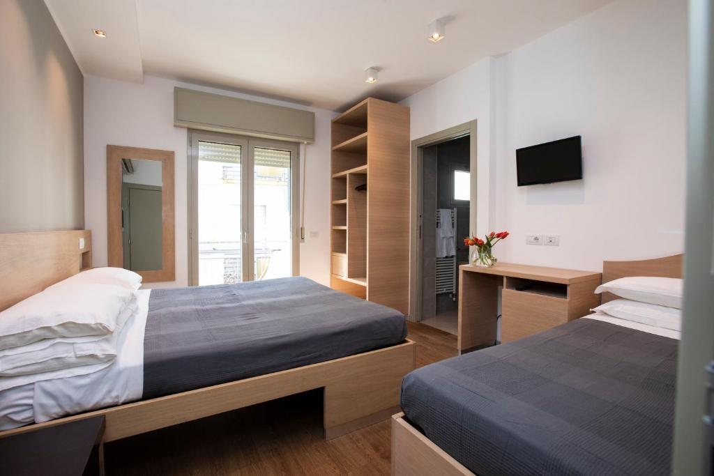 Postel nebo postele na pokoji v ubytování Hotel Liane Riccione