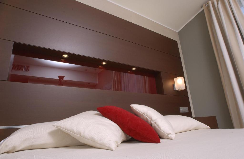 Postel nebo postele na pokoji v ubytování Inverigo Hotel