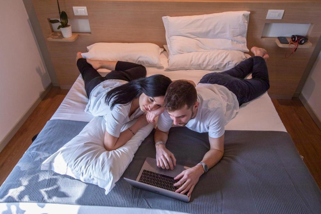 Postel nebo postele na pokoji v ubytování Hotel Liane Riccione