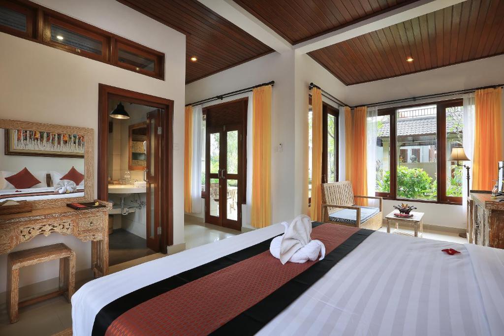 Postel nebo postele na pokoji v ubytování Ketut's Place Cottage Ubud