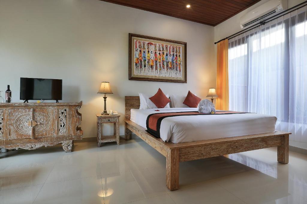 Postel nebo postele na pokoji v ubytování Ketut's Place Cottage Ubud