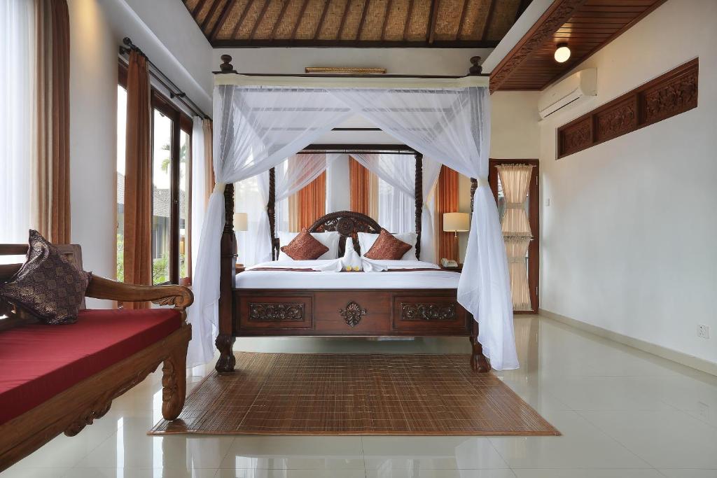 Postel nebo postele na pokoji v ubytování Ketut's Place Cottage Ubud