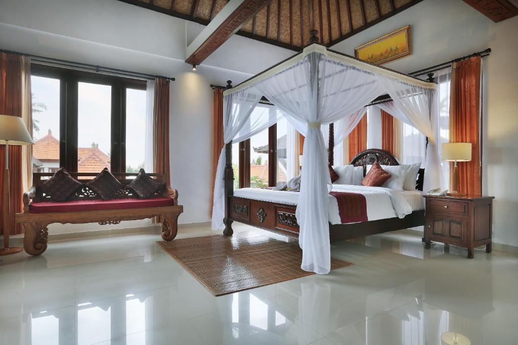 Postel nebo postele na pokoji v ubytování Ketut's Place Cottage Ubud