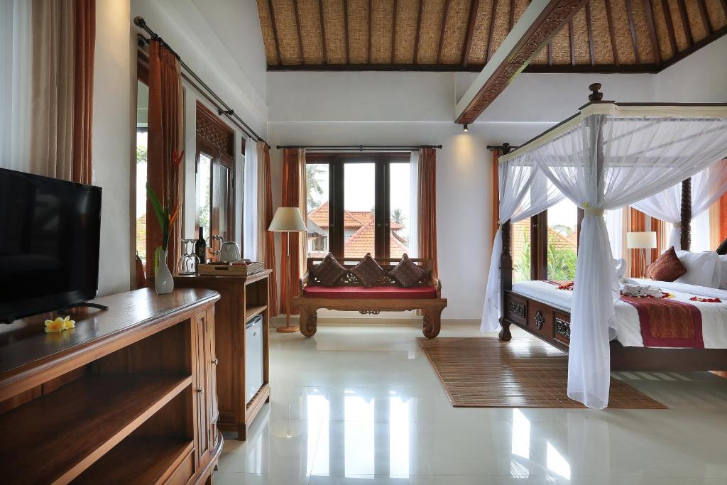 Postel nebo postele na pokoji v ubytování Ketut's Place Cottage Ubud