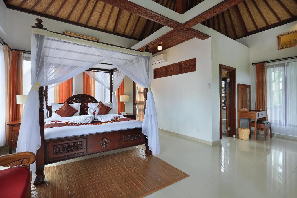 Postel nebo postele na pokoji v ubytování Ketut's Place Cottage Ubud
