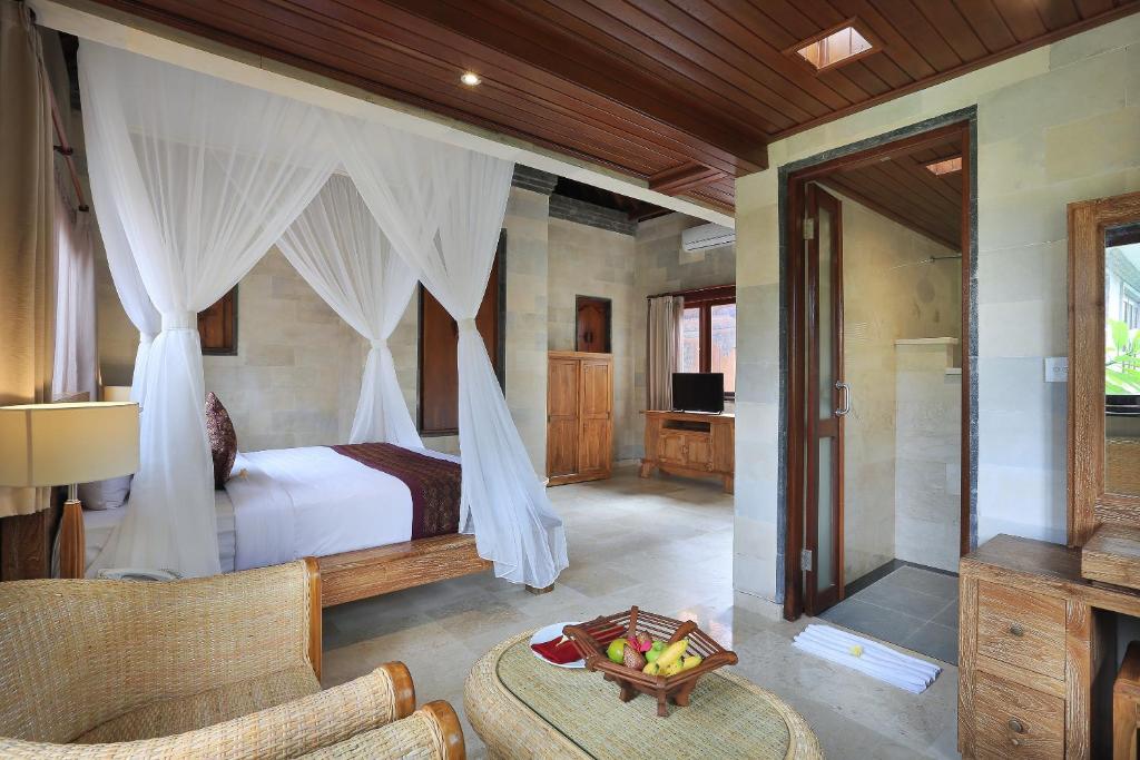 Postel nebo postele na pokoji v ubytování Ketut's Place Cottage Ubud