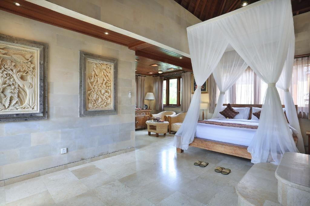Postel nebo postele na pokoji v ubytování Ketut's Place Cottage Ubud