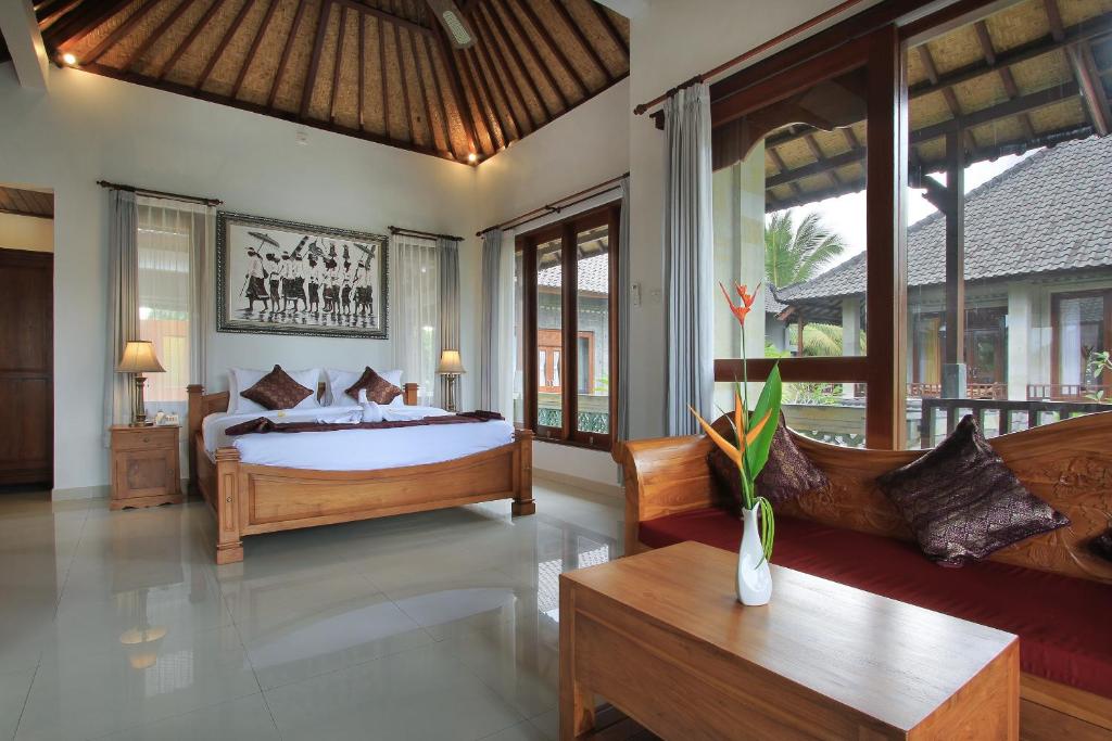 Postel nebo postele na pokoji v ubytování Ketut's Place Cottage Ubud
