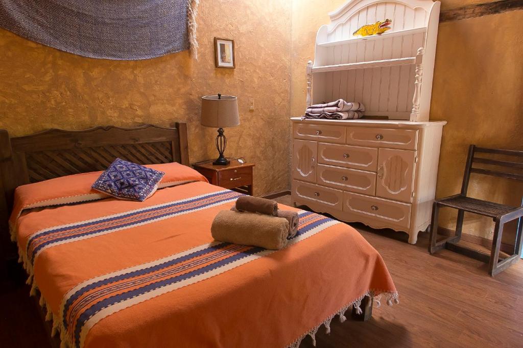 Postel nebo postele na pokoji v ubytování Posada del Abuelito (Hostel)
