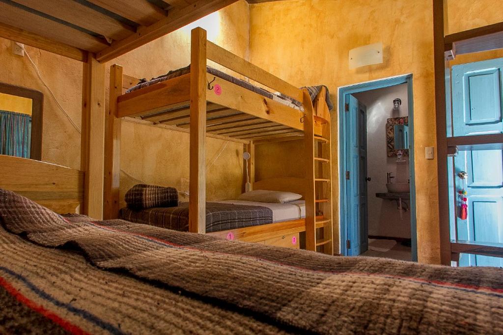 Postel nebo postele na pokoji v ubytování Posada del Abuelito (Hostel)