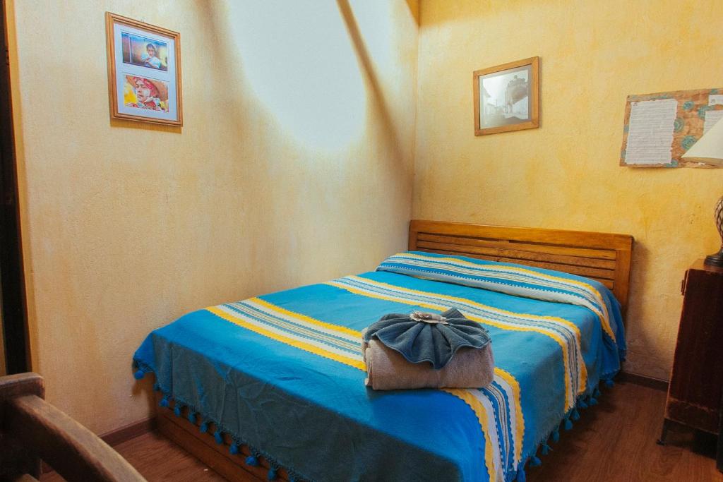 Postel nebo postele na pokoji v ubytování Posada del Abuelito (Hostel)