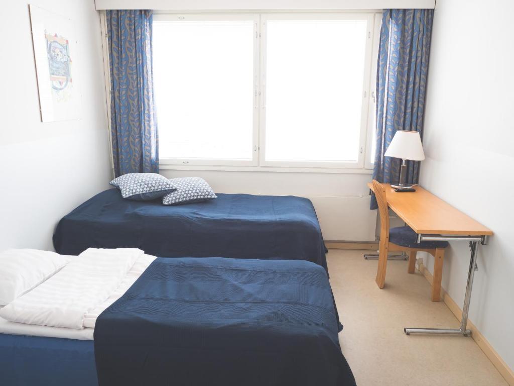 Кровать или кровати в номере Hotel Pietari Kylliäinen