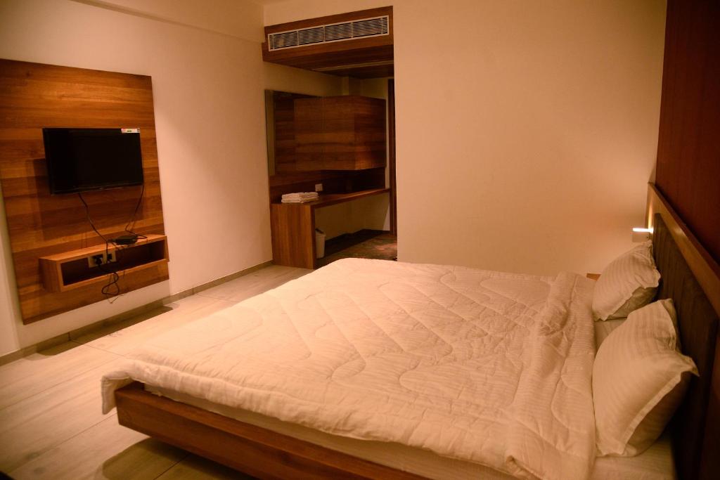 Postel nebo postele na pokoji v ubytování The Bliss Hotel