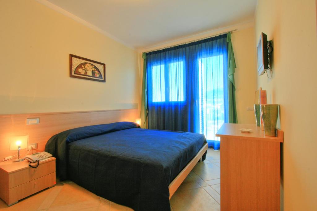 Postel nebo postele na pokoji v ubytování Posidonia Residence