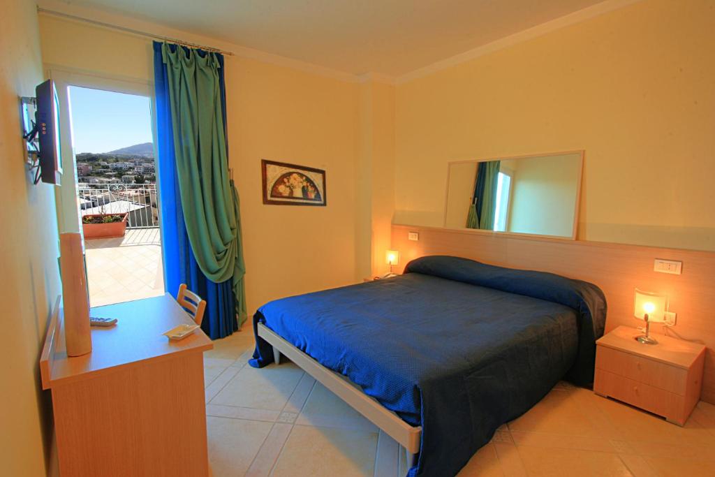 Postel nebo postele na pokoji v ubytování Posidonia Residence