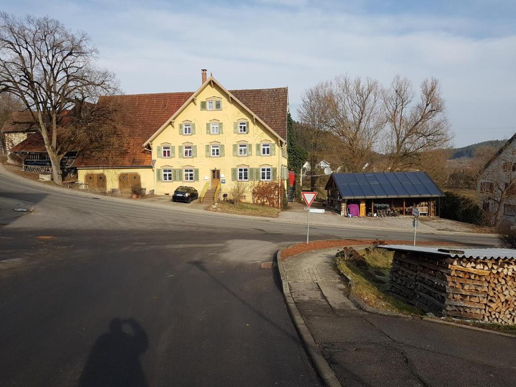 a shadow of a person walking down a street at Ferienwohnung Spreter in Zimmern ob Rottweil