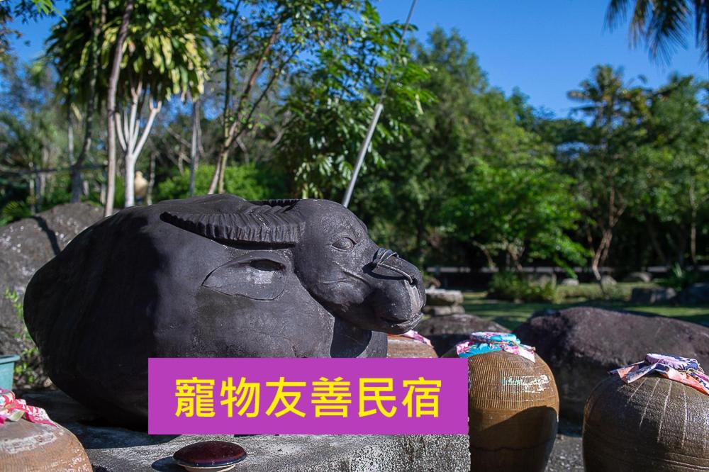 a statue of a ram with a pink sign on it at DOWN HWA NO.8 in Pinghe