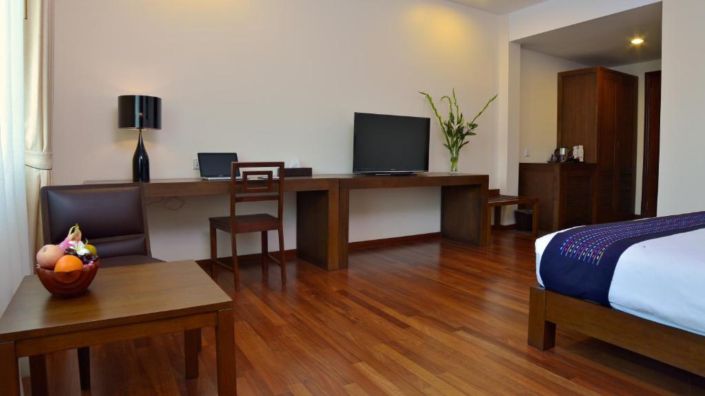 TV a/nebo společenská místnost v ubytování Emerald Palace Hotel