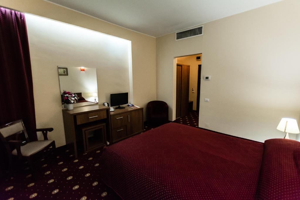 Postel nebo postele na pokoji v ubytování Hotel Ferdinand
