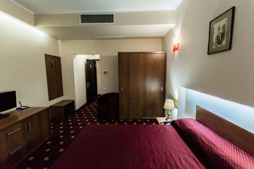 Postel nebo postele na pokoji v ubytování Hotel Ferdinand