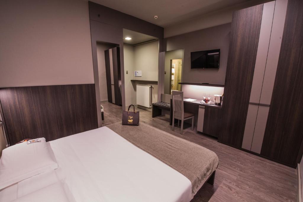 Postel nebo postele na pokoji v ubytování Hotel Bigio