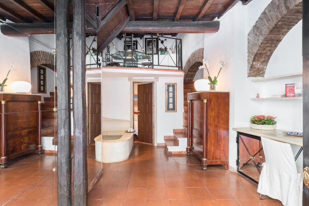 a large room with wooden beams at Cedro Terrace&Jacuzzi - Loft in Trastevere in Rome
