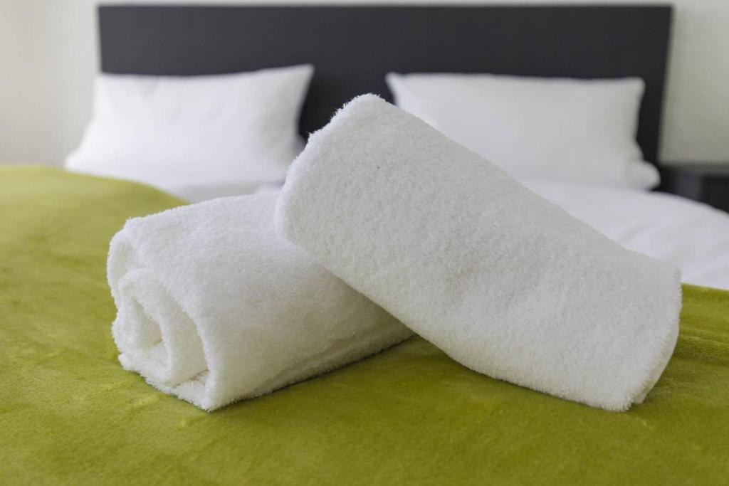 Postel nebo postele na pokoji v ubytování Hotel Berlin