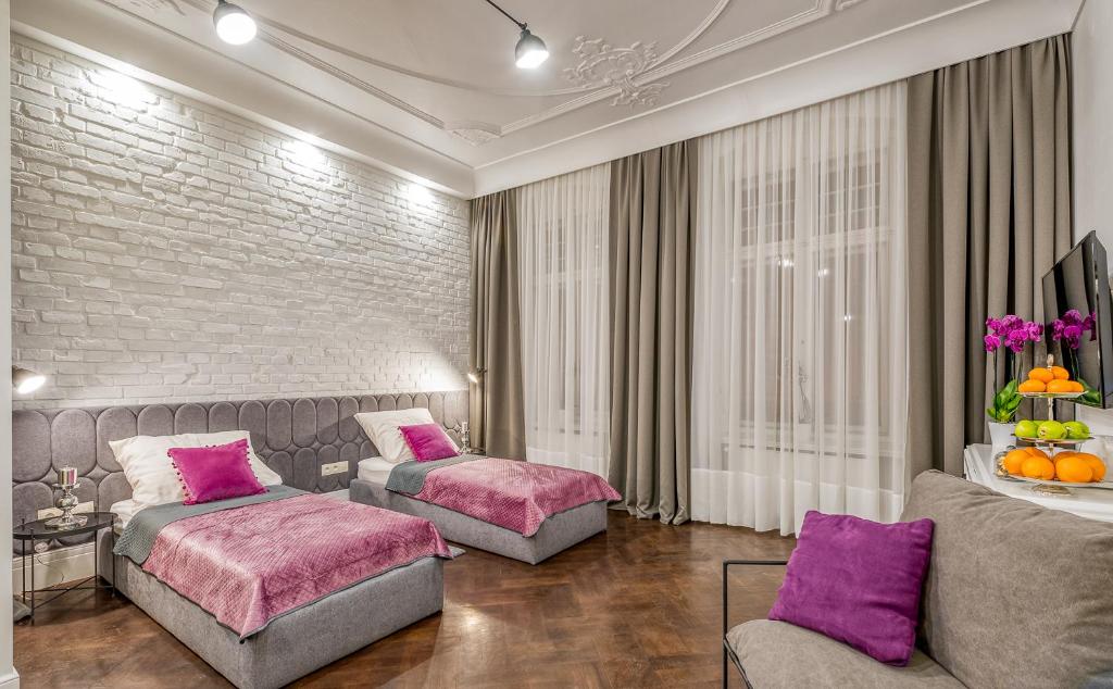 Posteľ alebo postele v izbe v ubytovaní Apartamenty "ArtAparts" Stare Miasto - Centrum