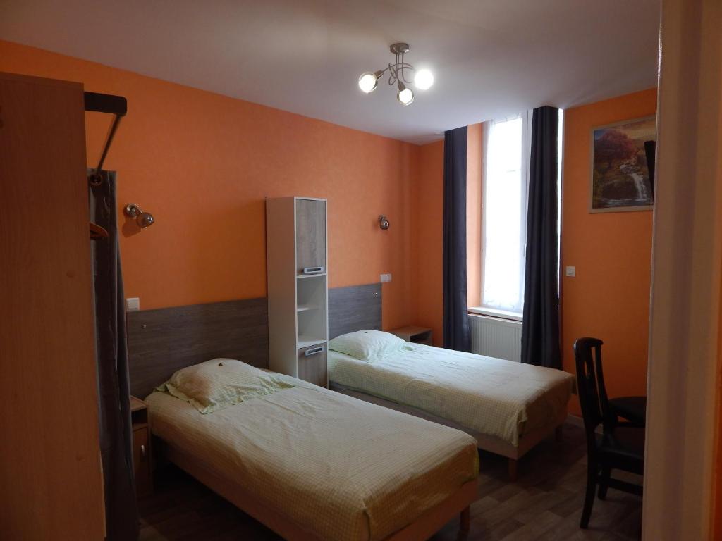 Postel nebo postele na pokoji v ubytování Le Lion D'or