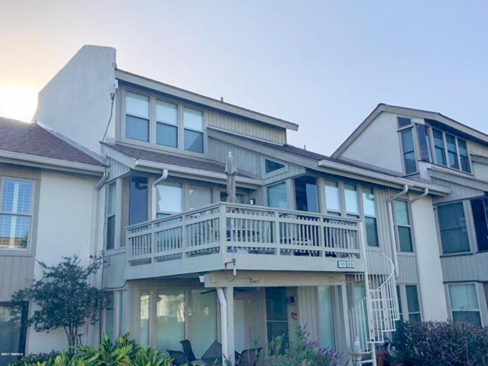 a large house with a porch and a balcony at 112 Capt John Fripp Villa in Fripp Island