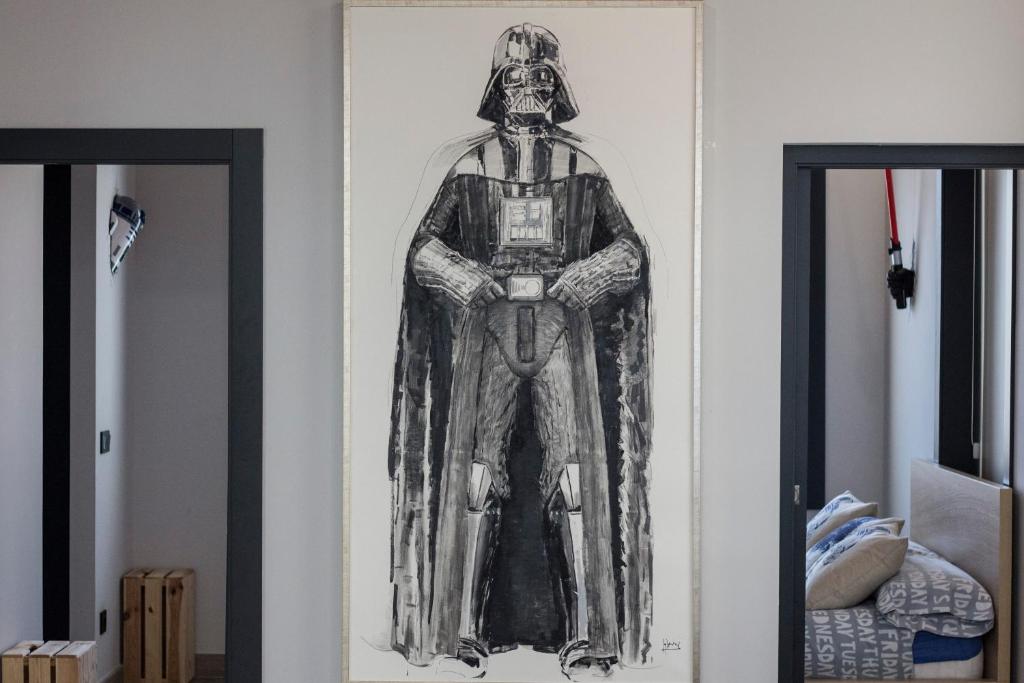 Postel nebo postele na pokoji v ubytování Star Wars Apartment
