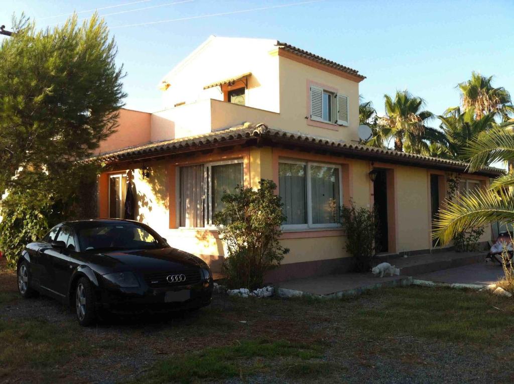 a black car parked in front of a house at Villa Ettore in Gardeládes