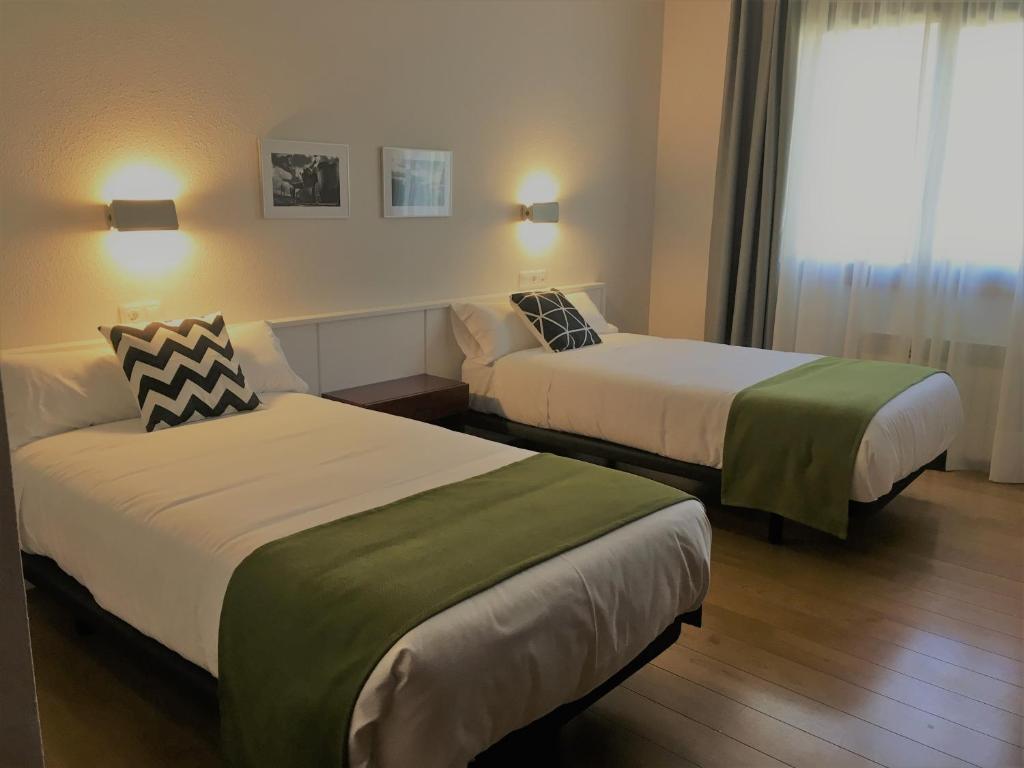 Postel nebo postele na pokoji v ubytování Hotel Elorrio