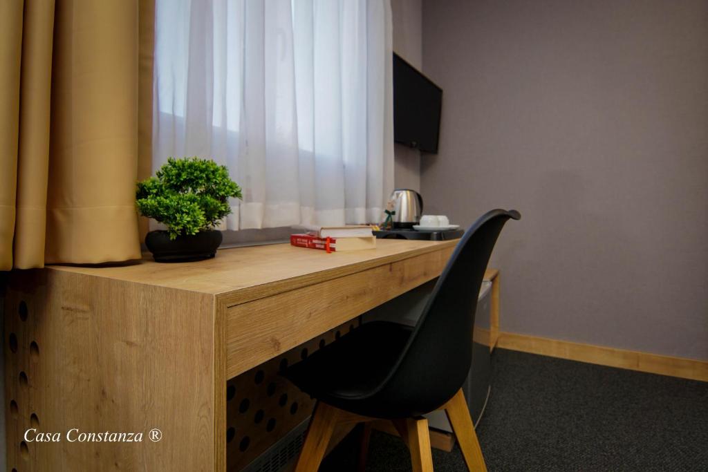 TV a/nebo společenská místnost v ubytování Casa Constanza Hotel Garni