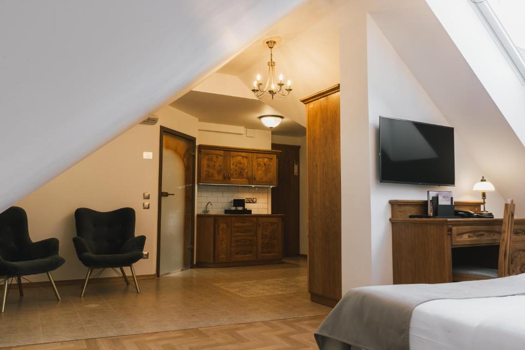 TV a/nebo společenská místnost v ubytování Hotel & Apartments Ventus Rosa
