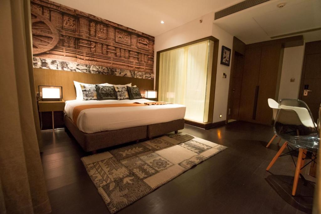 Postel nebo postele na pokoji v ubytování Hotel Gallery 67