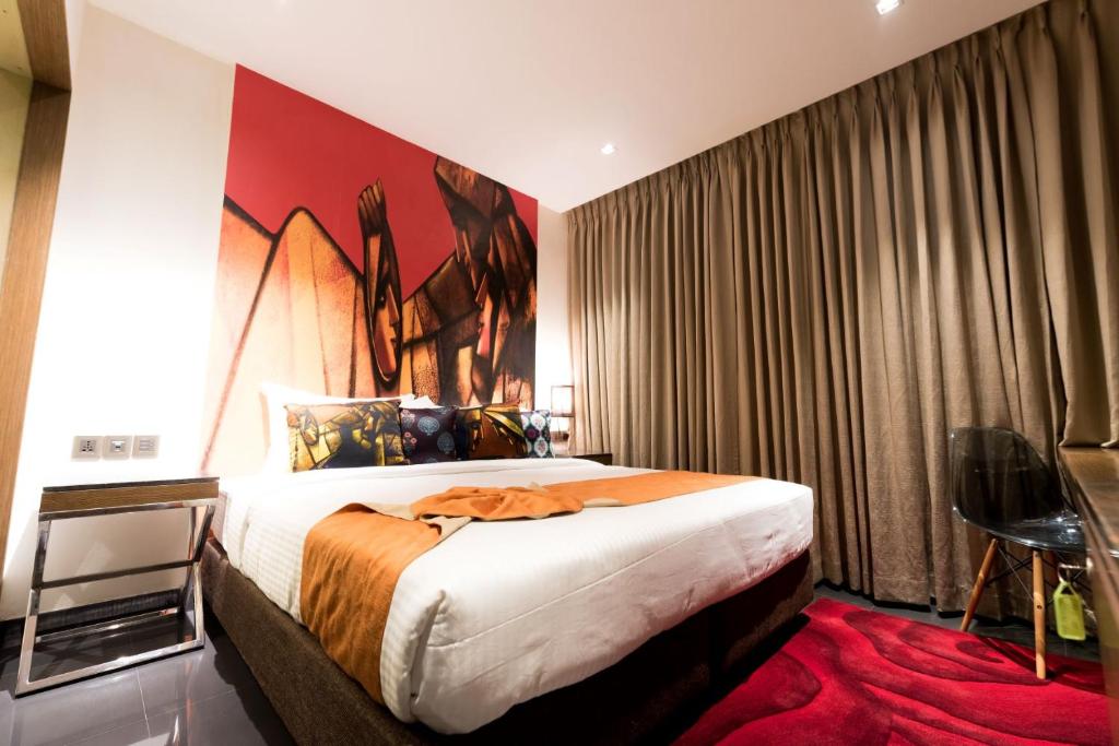 Postel nebo postele na pokoji v ubytování Hotel Gallery 67