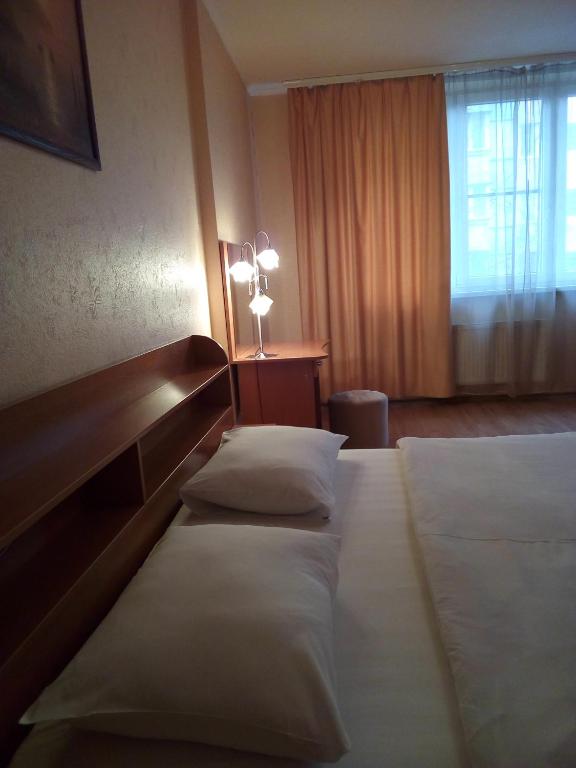 Postel nebo postele na pokoji v ubytování Comfort Hotel