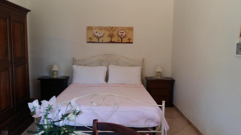 Postel nebo postele na pokoji v ubytování Agriturismo Le Scerze